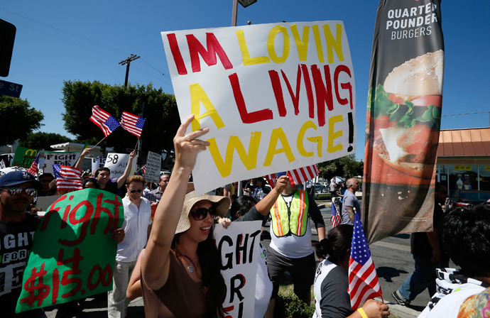 Workers and their supporters protest outside McDonald's as part of a nationwide strike by fast-food workers to call for wages of $15 an hour, in Los Angeles, California August 29, 2013. (Reuters / Lucy Nicholson)